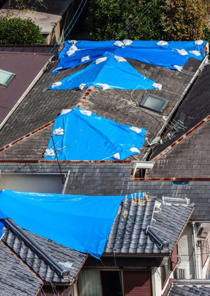 How to Repair or Replace Blown Off Roof Shingles on a House